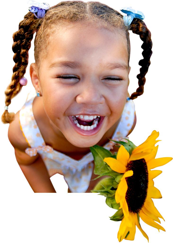 Happy smiling young girl holding a sunflower.